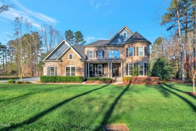 Nestled on a quiet street in the coveted Hasentree golf on Hasentree Club in North Carolina - for sale on GolfHomes.com, golf home, golf lot