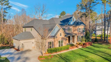 Nestled on a quiet street in the coveted Hasentree golf on Hasentree Club in North Carolina - for sale on GolfHomes.com, golf home, golf lot