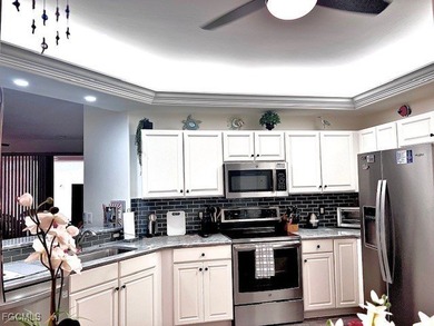 ENJOY PEACEFUL and Tranquil Lake Views in this First Floor 2 on Colonial Country Club in Florida - for sale on GolfHomes.com, golf home, golf lot