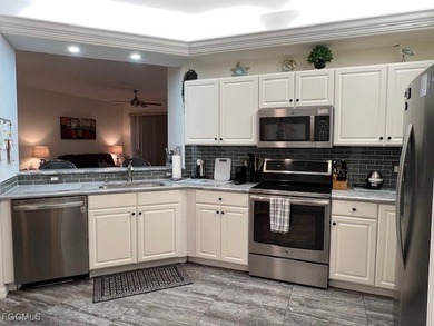 ENJOY PEACEFUL and Tranquil Lake Views in this First Floor 2 on Colonial Country Club in Florida - for sale on GolfHomes.com, golf home, golf lot