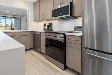 Welcome to your DREAM villa! This COMPLETELY updated 3-bedroom on Twin Isles Country Club in Florida - for sale on GolfHomes.com, golf home, golf lot