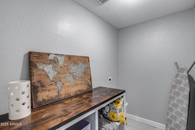 Beautifully updated 5-bedroom, 3-bath home tucked into a quiet on Arrowhead Country Club in Arizona - for sale on GolfHomes.com, golf home, golf lot