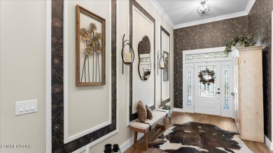 Welcome to 140 Utsesti Way! Discover contemporary elegance and on Toqua Golf Course - Loudon County in Tennessee - for sale on GolfHomes.com, golf home, golf lot