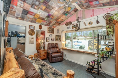 This eclectic-cozy cottage is located in Harrison MI ''20 Lakes on Devils Knob Golf Course in Michigan - for sale on GolfHomes.com, golf home, golf lot