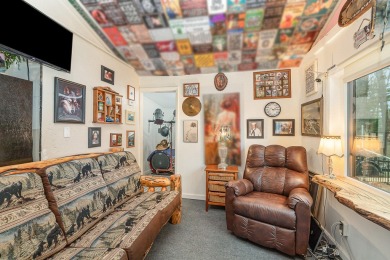 This eclectic-cozy cottage is located a stone throw away from on Devils Knob Golf Course in Michigan - for sale on GolfHomes.com, golf home, golf lot