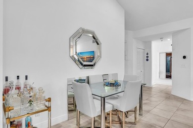 Welcome to this exceptionally remodeled second floor corner on Boca Pointe Country Club in Florida - for sale on GolfHomes.com, golf home, golf lot