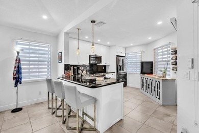 Welcome to this exceptionally remodeled second floor corner on Boca Pointe Country Club in Florida - for sale on GolfHomes.com, golf home, golf lot