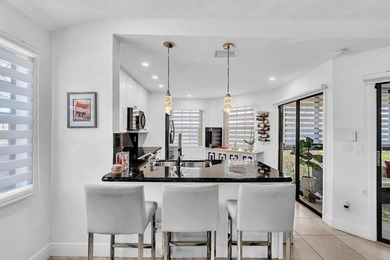 Welcome to this exceptionally remodeled second floor corner on Boca Pointe Country Club in Florida - for sale on GolfHomes.com, golf home, golf lot