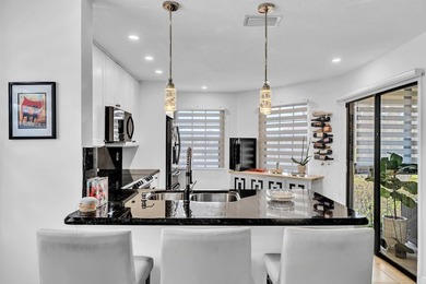 Welcome to this exceptionally remodeled second floor corner on Boca Pointe Country Club in Florida - for sale on GolfHomes.com, golf home, golf lot