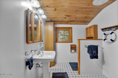 LAKEFRONT LOG DREAM HOME!  Real authentic log home nestled on on Forest Lake Club in Pennsylvania - for sale on GolfHomes.com, golf home, golf lot