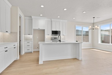 4 Car Garage, 2x6 exterior walls, fireplace with built-ins on Copper Rock Golf Course in Utah - for sale on GolfHomes.com, golf home, golf lot