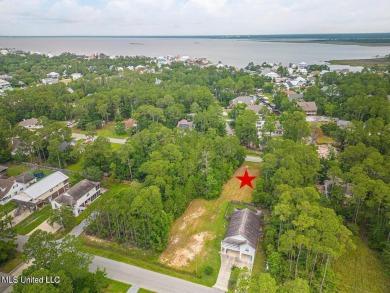 Cleared, level, and ready to build--this prime lot in Pass on Pass Christian Isles Golf Club in Mississippi - for sale on GolfHomes.com, golf home, golf lot