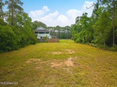 Cleared, level, and ready to build--this prime lot in Pass on Pass Christian Isles Golf Club in Mississippi - for sale on GolfHomes.com, golf home, golf lot
