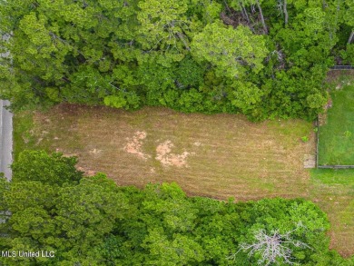 Cleared, level, and ready to build--this prime lot in Pass on Pass Christian Isles Golf Club in Mississippi - for sale on GolfHomes.com, golf home, golf lot