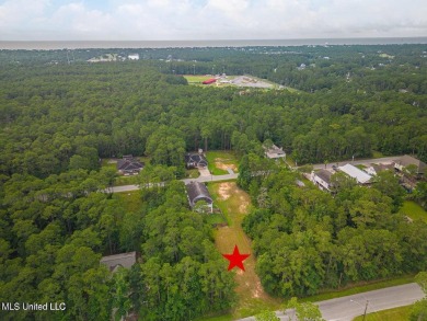 Cleared, level, and ready to build--this prime lot in Pass on Pass Christian Isles Golf Club in Mississippi - for sale on GolfHomes.com, golf home, golf lot