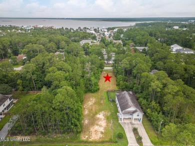 Cleared, level, and ready to build--this prime lot in Pass on Pass Christian Isles Golf Club in Mississippi - for sale on GolfHomes.com, golf home, golf lot