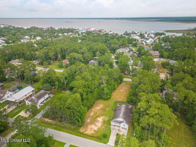 Cleared, level, and ready to build--this prime lot in Pass on Pass Christian Isles Golf Club in Mississippi - for sale on GolfHomes.com, golf home, golf lot