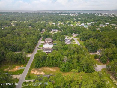 Cleared, level, and ready to build--this prime lot in Pass on Pass Christian Isles Golf Club in Mississippi - for sale on GolfHomes.com, golf home, golf lot