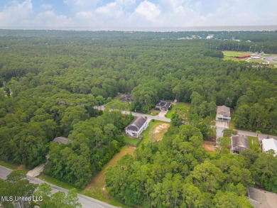 Cleared, level, and ready to build--this prime lot in Pass on Pass Christian Isles Golf Club in Mississippi - for sale on GolfHomes.com, golf home, golf lot