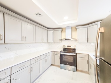 Beautifully renovated 2-bedroom, 1.5-bath ranch with carport on Rossmoor Golf Club in New Jersey - for sale on GolfHomes.com, golf home, golf lot