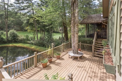 The fabulous outdoor great room defines this charming, classic on Highlands Country Club in North Carolina - for sale on GolfHomes.com, golf home, golf lot