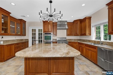 Set on a beautifully landscaped acre with a stunning circular on Old Tappan Golf Course in New Jersey - for sale on GolfHomes.com, golf home, golf lot