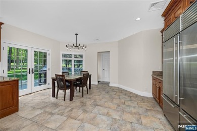 Set on a beautifully landscaped acre with a stunning circular on Old Tappan Golf Course in New Jersey - for sale on GolfHomes.com, golf home, golf lot