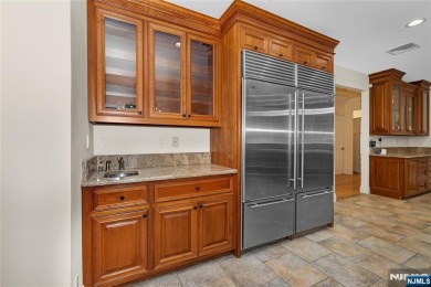 Set on a beautifully landscaped acre with a stunning circular on Old Tappan Golf Course in New Jersey - for sale on GolfHomes.com, golf home, golf lot