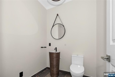 Set on a beautifully landscaped acre with a stunning circular on Old Tappan Golf Course in New Jersey - for sale on GolfHomes.com, golf home, golf lot