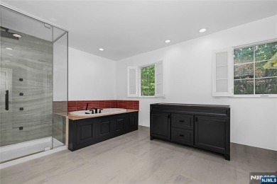 Set on a beautifully landscaped acre with a stunning circular on Old Tappan Golf Course in New Jersey - for sale on GolfHomes.com, golf home, golf lot