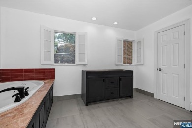 Set on a beautifully landscaped acre with a stunning circular on Old Tappan Golf Course in New Jersey - for sale on GolfHomes.com, golf home, golf lot