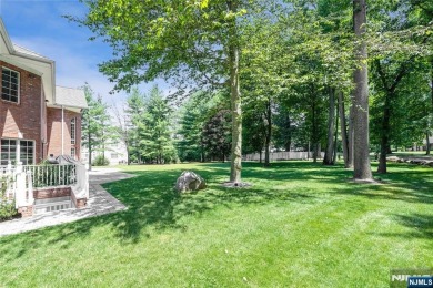 Set on a beautifully landscaped acre with a stunning circular on Old Tappan Golf Course in New Jersey - for sale on GolfHomes.com, golf home, golf lot