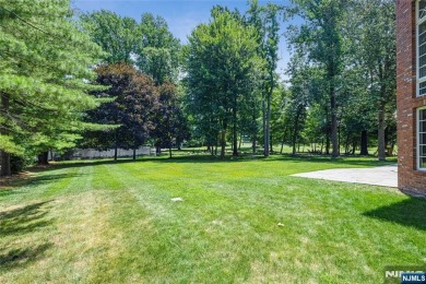 Set on a beautifully landscaped acre with a stunning circular on Old Tappan Golf Course in New Jersey - for sale on GolfHomes.com, golf home, golf lot