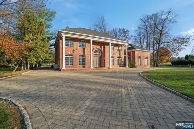 Set on a beautifully landscaped acre with a stunning circular on Old Tappan Golf Course in New Jersey - for sale on GolfHomes.com, golf home, golf lot