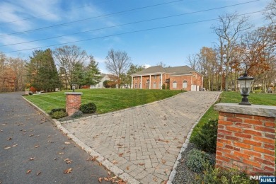 Set on a beautifully landscaped acre with a stunning circular on Old Tappan Golf Course in New Jersey - for sale on GolfHomes.com, golf home, golf lot