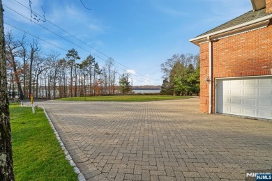 Set on a beautifully landscaped acre with a stunning circular on Old Tappan Golf Course in New Jersey - for sale on GolfHomes.com, golf home, golf lot
