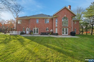 Set on a beautifully landscaped acre with a stunning circular on Old Tappan Golf Course in New Jersey - for sale on GolfHomes.com, golf home, golf lot