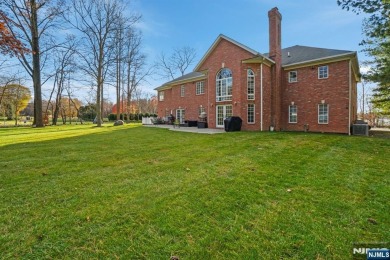 Set on a beautifully landscaped acre with a stunning circular on Old Tappan Golf Course in New Jersey - for sale on GolfHomes.com, golf home, golf lot