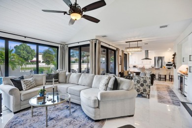 This exceptional waterfront home in Deerfield Beach, FL on Deer Creek Golf Club in Florida - for sale on GolfHomes.com, golf home, golf lot