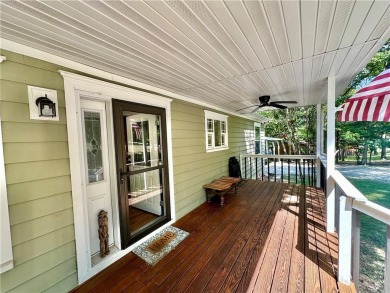 Adorable single-level home on nearly an acre of rare flat land on Holiday Island Executive Golf Course in Arkansas - for sale on GolfHomes.com, golf home, golf lot