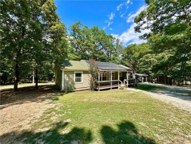 Adorable single-level home on nearly an acre of rare flat land on Holiday Island Executive Golf Course in Arkansas - for sale on GolfHomes.com, golf home, golf lot