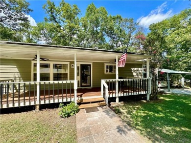 Adorable single-level home on nearly an acre of rare flat land on Holiday Island Executive Golf Course in Arkansas - for sale on GolfHomes.com, golf home, golf lot