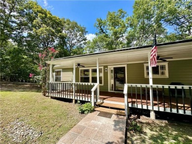 Adorable single-level home on nearly an acre of rare flat land on Holiday Island Executive Golf Course in Arkansas - for sale on GolfHomes.com, golf home, golf lot