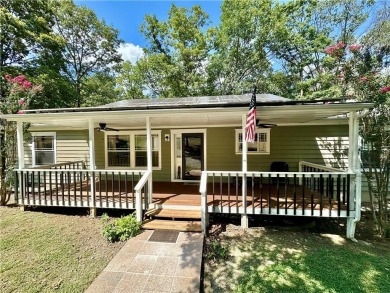 Adorable single-level home on nearly an acre of rare flat land on Holiday Island Executive Golf Course in Arkansas - for sale on GolfHomes.com, golf home, golf lot