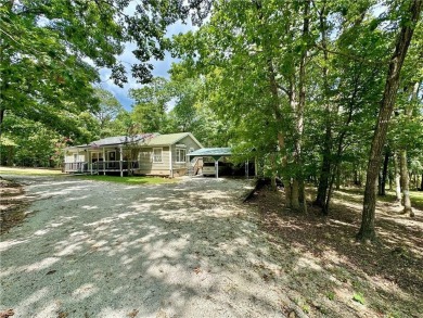 Adorable single-level home on nearly an acre of rare flat land on Holiday Island Executive Golf Course in Arkansas - for sale on GolfHomes.com, golf home, golf lot