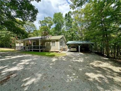Adorable single-level home on nearly an acre of rare flat land on Holiday Island Executive Golf Course in Arkansas - for sale on GolfHomes.com, golf home, golf lot