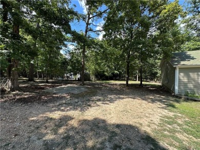 Adorable single-level home on nearly an acre of rare flat land on Holiday Island Executive Golf Course in Arkansas - for sale on GolfHomes.com, golf home, golf lot