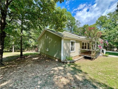 Adorable single-level home on nearly an acre of rare flat land on Holiday Island Executive Golf Course in Arkansas - for sale on GolfHomes.com, golf home, golf lot