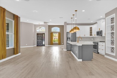 This beautifully renovated 4-bedroom, 3-bathroom home spans 2 on Oaks National Golf Course in Florida - for sale on GolfHomes.com, golf home, golf lot