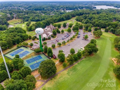 Nestled within a cul-de-sac, this charming property is situated on Tega Cay Golf Club in South Carolina - for sale on GolfHomes.com, golf home, golf lot